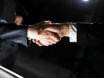 Handshaking business people Stock Photo