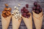 Concept For Homemade Various Nuts Ice Cream. Mixed Nuts In Waffl Stock Photo