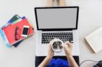 Women Sitting And Handtake Cup Of Hot Coffee Watching Media Stock Photo