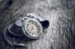 Pocket Watch On Old Wooden Background Stock Photo