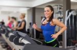 Woman Running On Treadmill Stock Photo