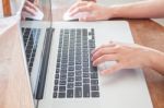 Close Up Of Woman Using Notebook Stock Photo