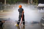 Fireman. Firefighters Fighting Fire During Training Stock Photo