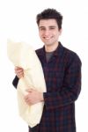 Man In Pajamas Holding Pillow Stock Photo