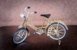 Small Gold Color Toy Bicycle Stock Photo