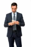 Half Length Portrait Of A Businessman Counting Money Stock Photo