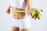 Woman Measuring Her Slim Body. Isolated On White Background Stock Photo