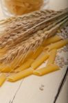 Italian Pasta Penne With Wheat Stock Photo