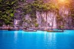 Long Boat And Blue Water At Maya Bay In Phi Phi Island, Krabi Thailand Stock Photo