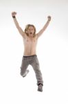 Handsome Male Jumping High In Joy Stock Photo