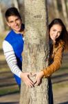 Happy Young Couple  In Love Having Fun At The Park Stock Photo