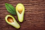 Avocado On A Brown Wood Background Stock Photo