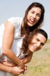 Young Man Piggyback His Girlfriend Stock Photo