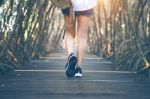 Woman Walking On Wooden Bridge. Vintage Tone Stock Photo