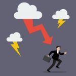 Businessman Run Away From Thunderstorm Stock Photo