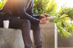 Asian Indian Businessman Using Tablet Pc Outdoors, Golden Sunlig Stock Photo