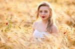 Portrait Of Beautiful Girl In Field Stock Photo