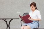 Portrait Of Thai Adult Businesswoman Beautiful Girl Read A Book Stock Photo