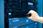 Man Fix Server Network In Data Center Room Stock Photo