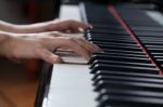 A Woman Playing Piano Stock Photo