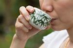 Asian Woman Drinking Tea Stock Photo