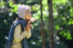 Woman Smiling Outside In Forest Stock Photo