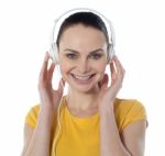 Young Female Enjoying Music Stock Photo