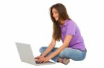 Smiling Teenage Girl Using Laptop Stock Photo