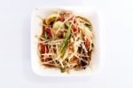 Thai Food Papaya Salad On White Dish Stock Photo