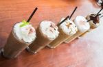 Variety Iced Coffee Drinks On Wooden Table Stock Photo