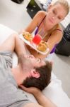 Couple Having Breakfast In Bed Stock Photo