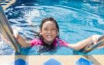 Girl Side Of Swimming Pool Stock Photo