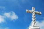 Cross In Clouds And Blue Sky Stock Photo