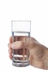 Man's Hand Holding Glass Of Water, Isolated On White Background Stock Photo