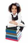 Pretty Schoolgirl Reading A Textbook Stock Photo