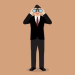 Businessman With Binoculars Stock Photo