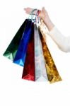 Female Hand Holding Shopping Bags Stock Photo