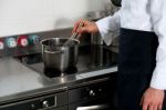 Chef In Restaurant Kitchen Stock Photo