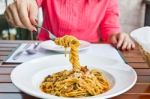 Female Eating Spaghetti In Dining Stock Photo