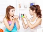 Teenage Girls Polishing Fingernails Stock Photo