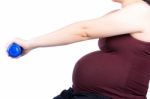 Pregnant Woman Exercising With Dumbbell Stock Photo