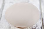 Duck Egg On White Painted Table Surface Stock Photo