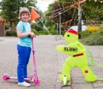 Girl On Step With Safety Figurine Stock Photo