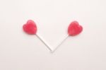 Two Pink Valentine's Day Heart Shape Lollipop Candy On Empty White Paper Background. Love Concept. Knolling Top View. Minimalism Colorful Hipster Style Stock Photo