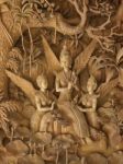 Goddess, Wood Carving In A Thai Temple Stock Photo