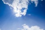 Blue Sky With Clouds And Sunlight Stock Photo