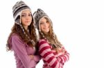 Two Young Friends Wearing Woolen Cap And Looking At Camera Stock Photo