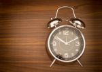 Alarm Clock On Wooden Background Stock Photo