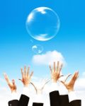 Hands Holding Bubbles On Sky Stock Photo