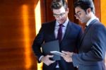 Businessmen With Digital Tablet  In Modern Office Stock Photo